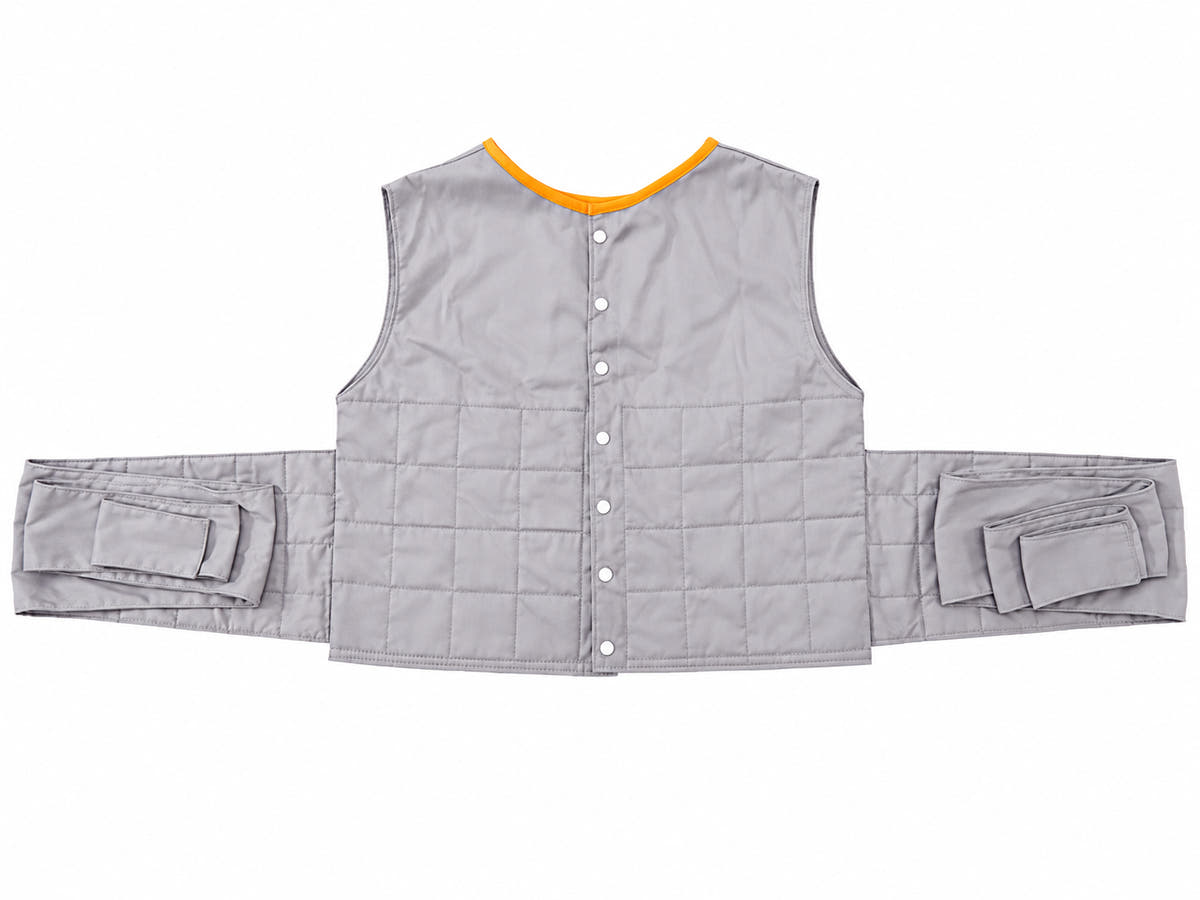 Patient positioning vest in gray with orange trim on a clean white background